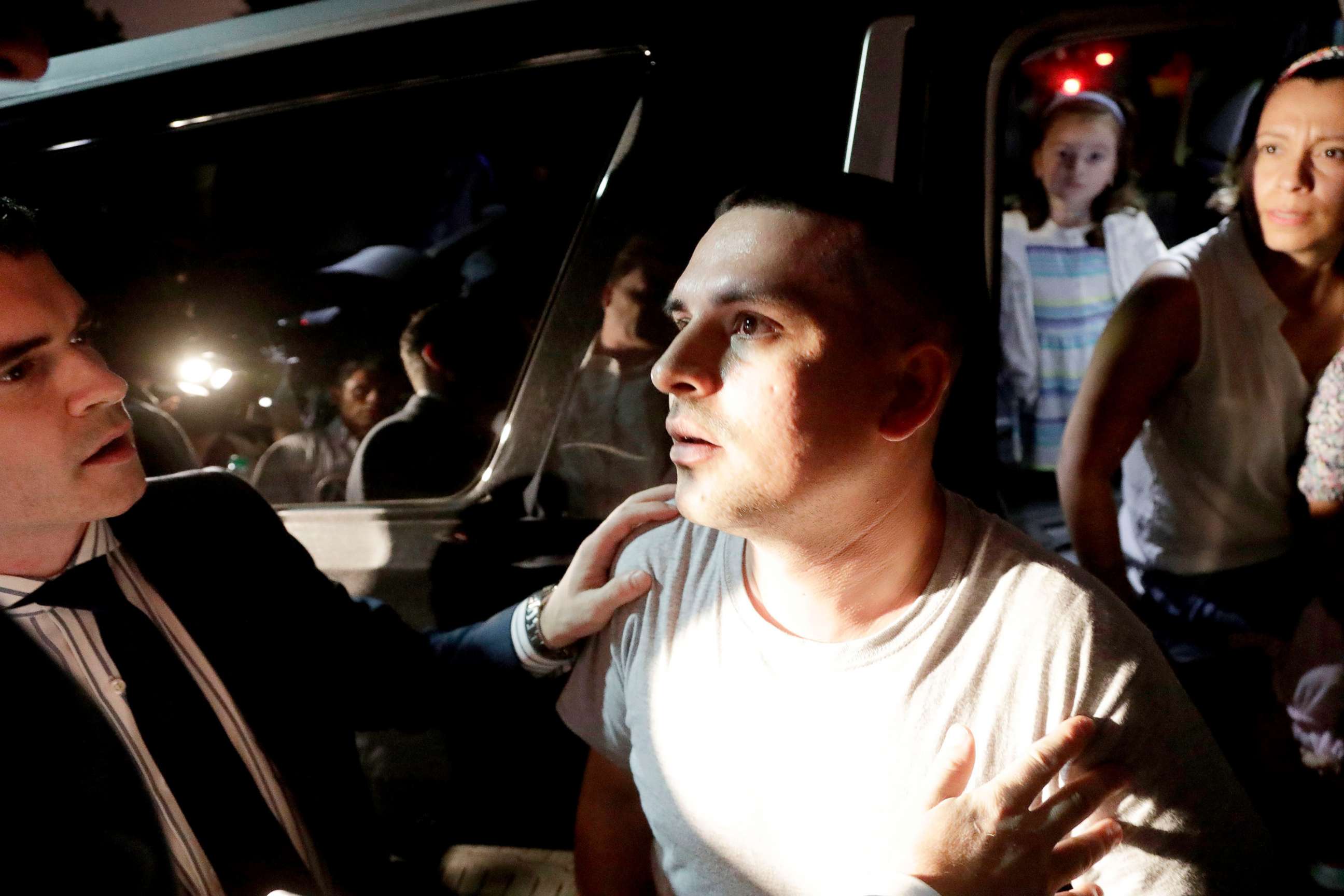 PHOTO: Pablo Villavicencio, center, is helped into an SUV, where his wife, Sandra Chica, right, and their daughters await after he was released from the Hudson County Correctional Facility, July 24, 2018, in Kearny, N.J.