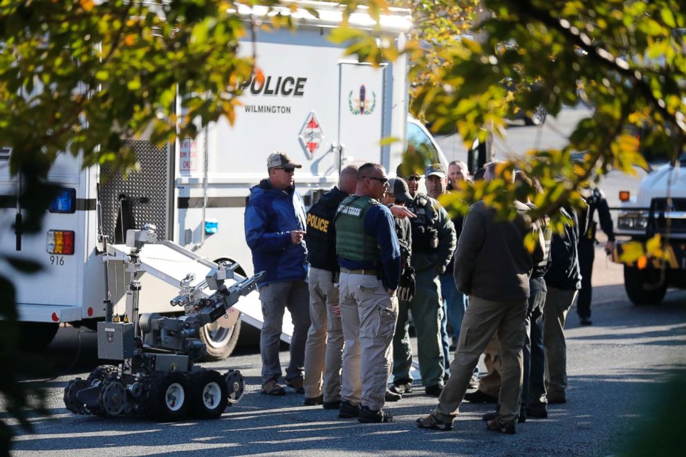 PHOTO: Local and federal authorities remove a suspicious package found at a US postal facility in Wilmington, Del., Oct. 25, 2018. A law enforcement official said suspicious packages addressed to former Vice President Joe Biden were intercepted.