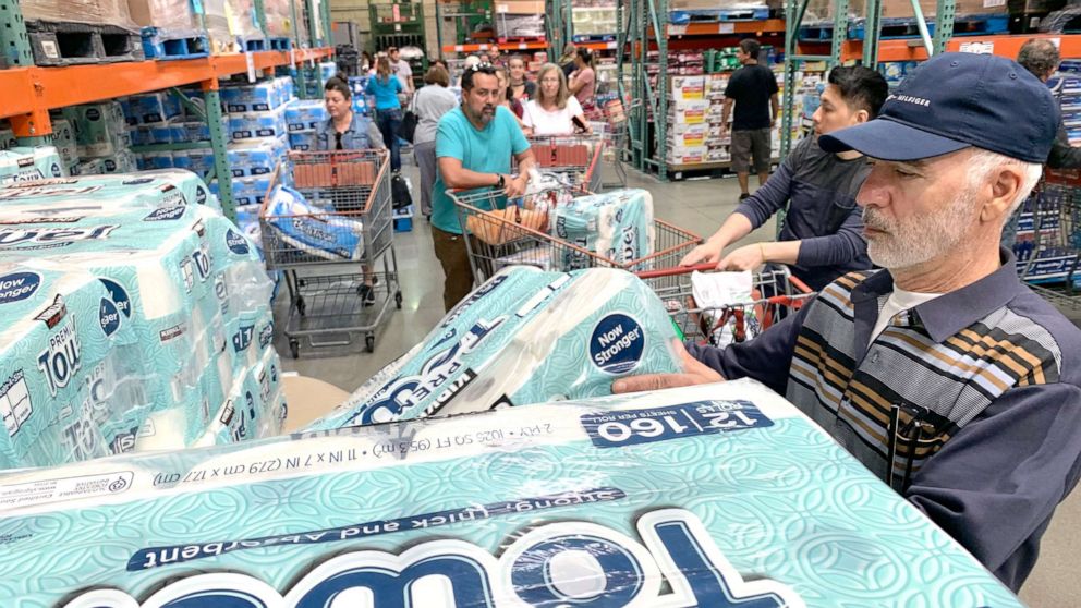 PHOTO: Customers line up to buy toilet paper, on fears that the coronavirus, COVID-19, will spread and force people to stay indoors, at a Costco in Burbank, Calif., March 6, 2020. 