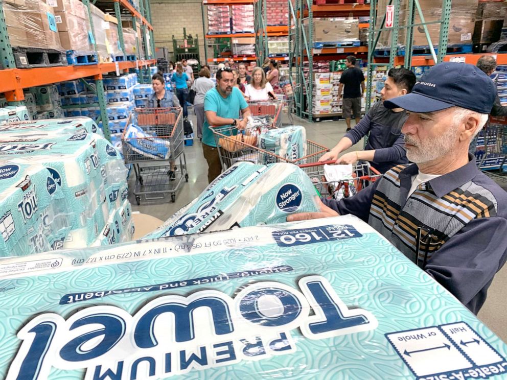 PHOTO: Customers line up to buy toilet paper, on fears that the coronavirus, COVID-19, will spread and force people to stay indoors, at a Costco in Burbank, Calif., March 6, 2020. 