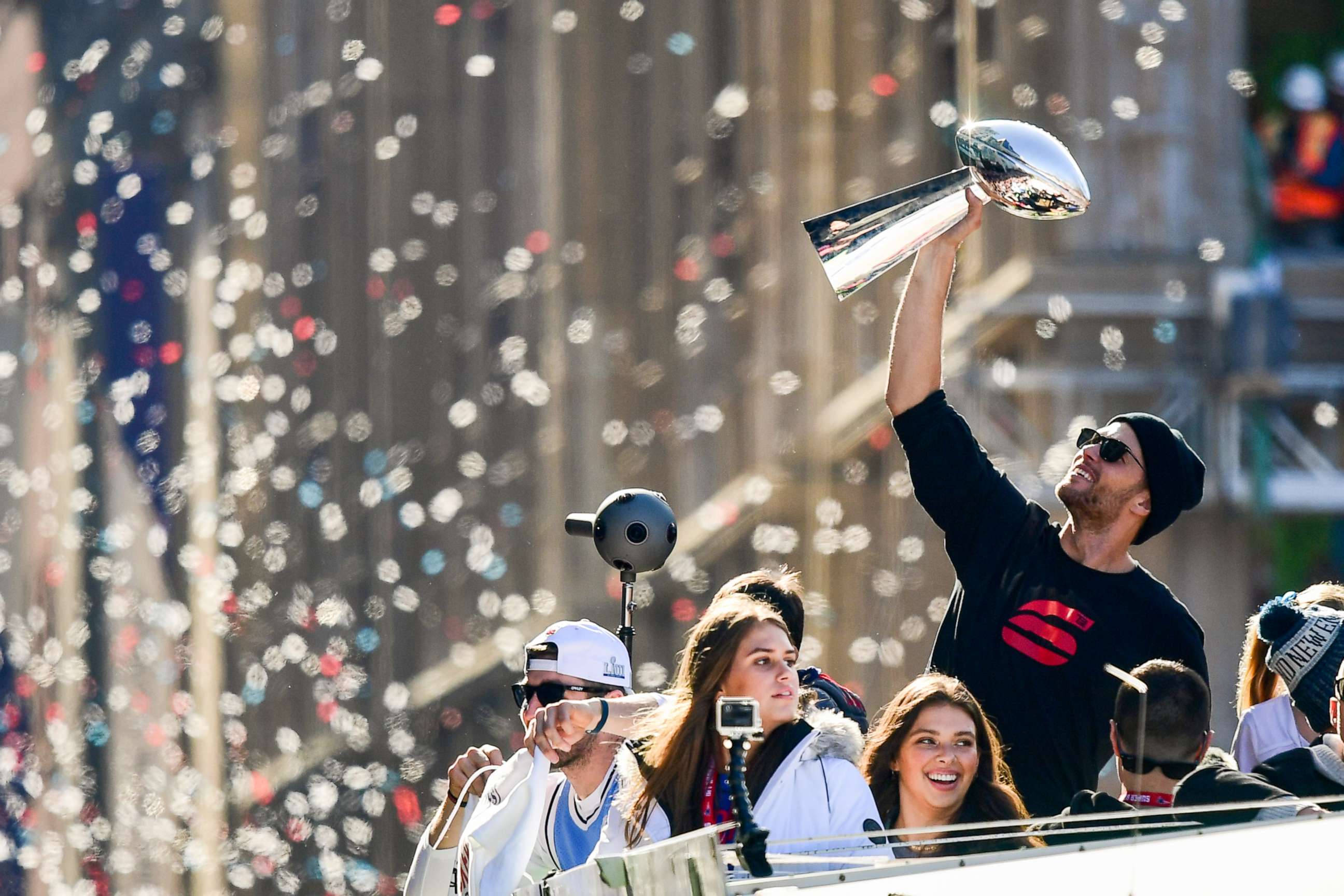 PHOTO: Tom Brady #12 of the New England Patriots reacts as he holds the Vince Lombardi trophy during the Super Bowl Victory Parade, Feb. 5, 2019, in Boston. 