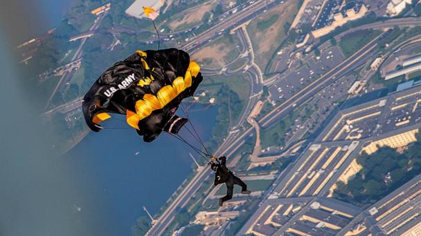 A member of the U.S. Army Golden Knights parachute team jumps during their performance for the Twilight Tattoo ceremony as part of the Army's 250th Birthday Festival in Washington, June 11, 2025. 