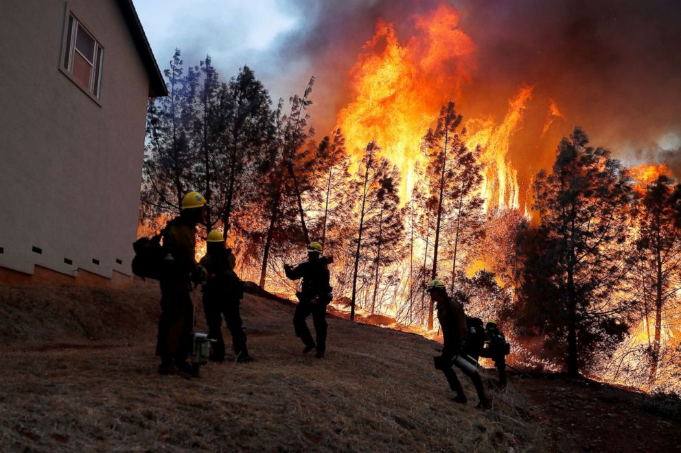 PHOTO: A group of U.S. Forest Service firefighters monitor a back fire while battling to save homes at the Camp Fire in Paradise, Calif., Nov. 8, 2018.