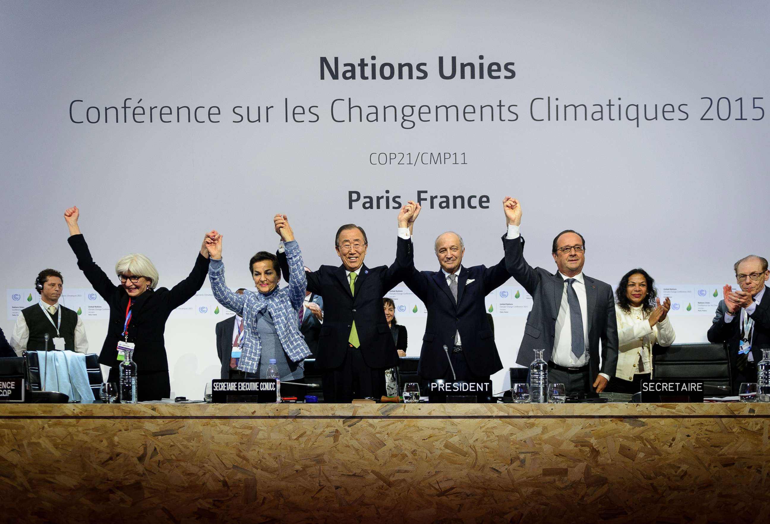 PHOTO: Executive Secretary of the United Nations Framework Convention on Climate Change (UNFCCC) raise hands together after adoption of a historic global warming pact at the COP21 Climate Conference in Le Bourget, north of Paris, Dec. 12, 2015.