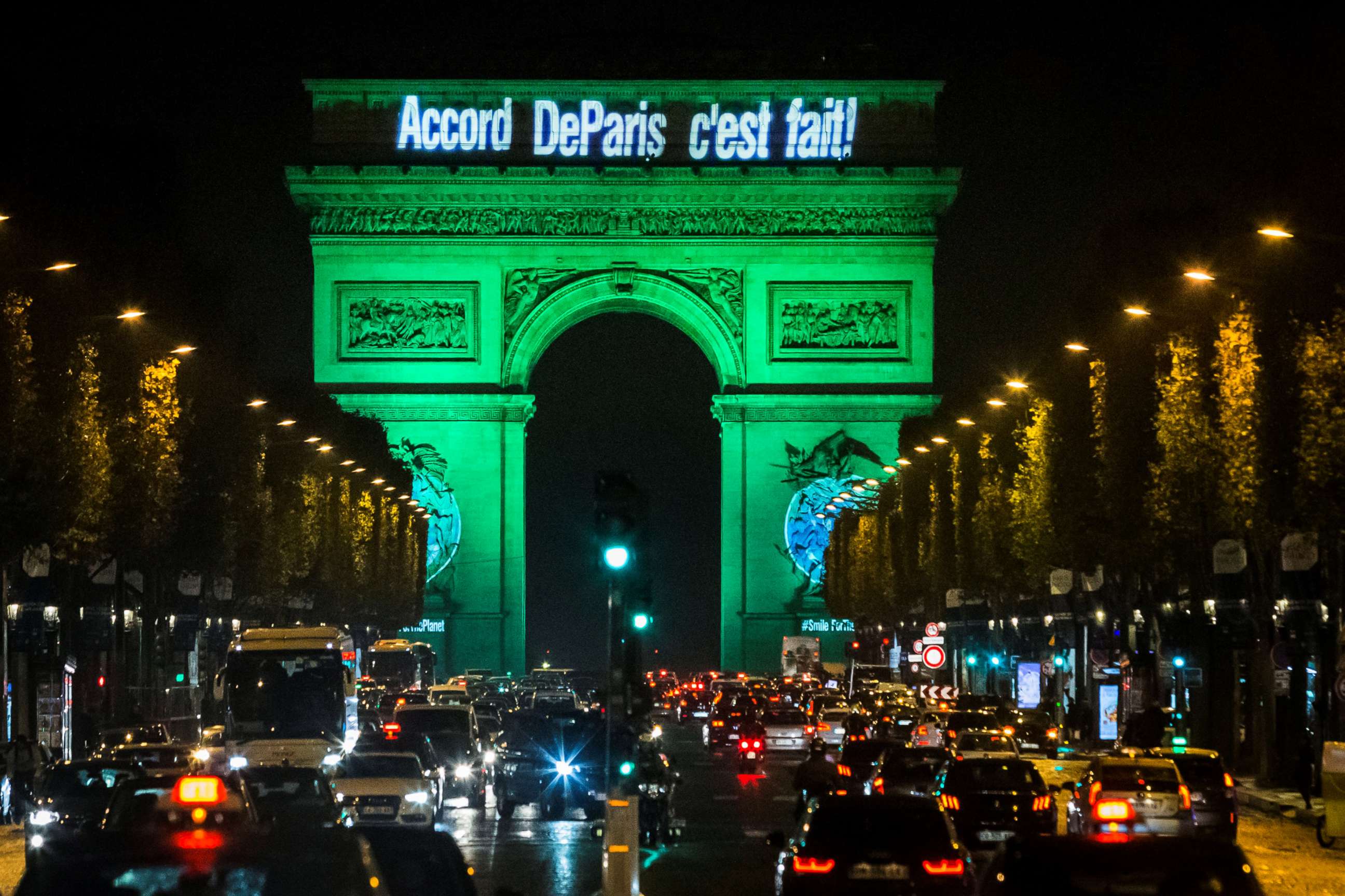 PHOTO: The Arc de Triomphe is illuminated in green to celebrate the ratification of the COP21 (Conference of the Parties Climate Conference) climate change agreement in Paris, Nov. 4, 2016. 