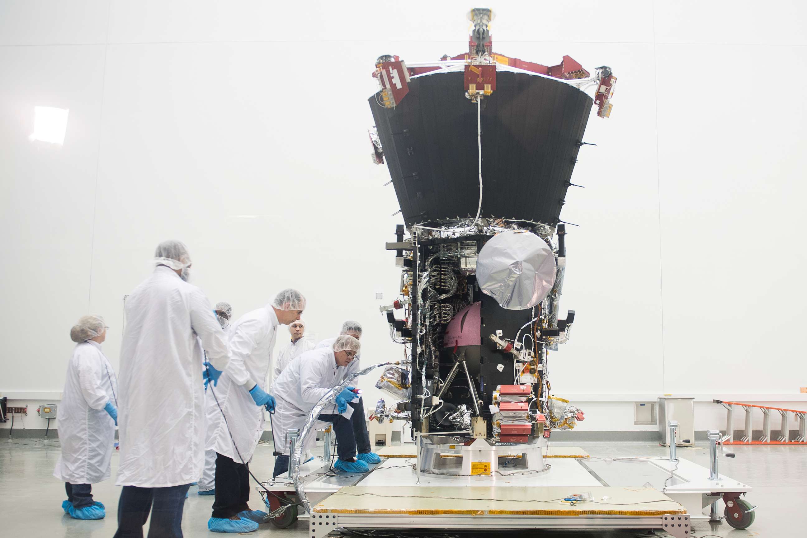 PHOTO: Engineers examine the Parker Solar Probe during a media preview at NASA Goddard Space Flight Center in Greenbelt, Md., March 28, 2018.