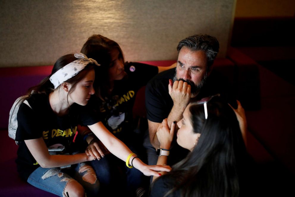 PHOTO: Manuel Oliver, the father of Joaquin Oliver one of the victims of the mass shooting, cries next to his family after painting a mural to commemorate the victims of the shooting and promote gun control in Los Angeles, April 7, 2018.