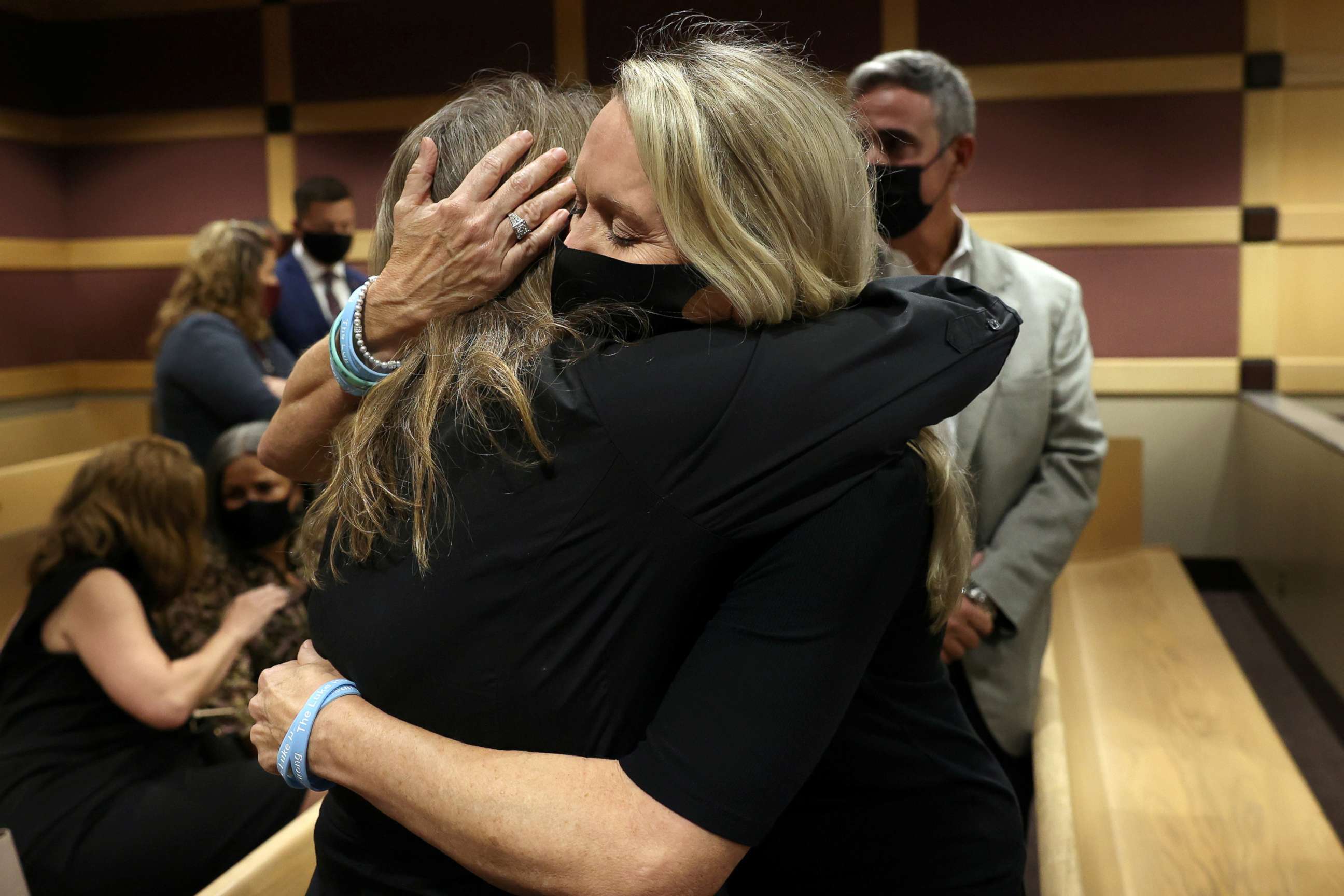PHOTO: Gena Hoyer, mother of Luke Hoyer, hugs Debbie Hixon during a court recess following the guilty pleas of Parkland school shooter Nikolas Cruz at the Broward County Courthouse in Fort Lauderdale, Fla., Oct. 20, 2021. 