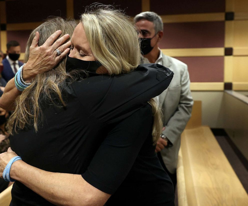 PHOTO: Gena Hoyer, mother of Luke Hoyer, hugs Debbie Hixon during a court recess following the guilty pleas of Parkland school shooter Nikolas Cruz at the Broward County Courthouse in Fort Lauderdale, Fla., Oct. 20, 2021. 