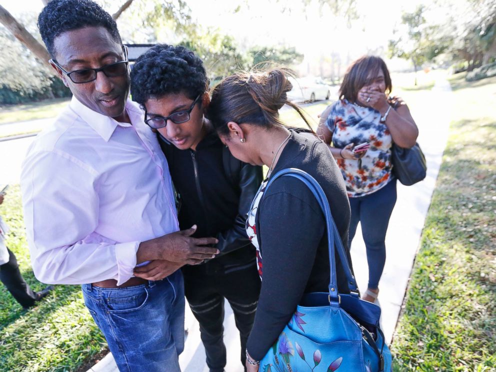 PHOTO: Family members embrace after a student walked out from Marjory Stoneman Douglas High School, Feb. 14, 2018, in Parkland, Fla.