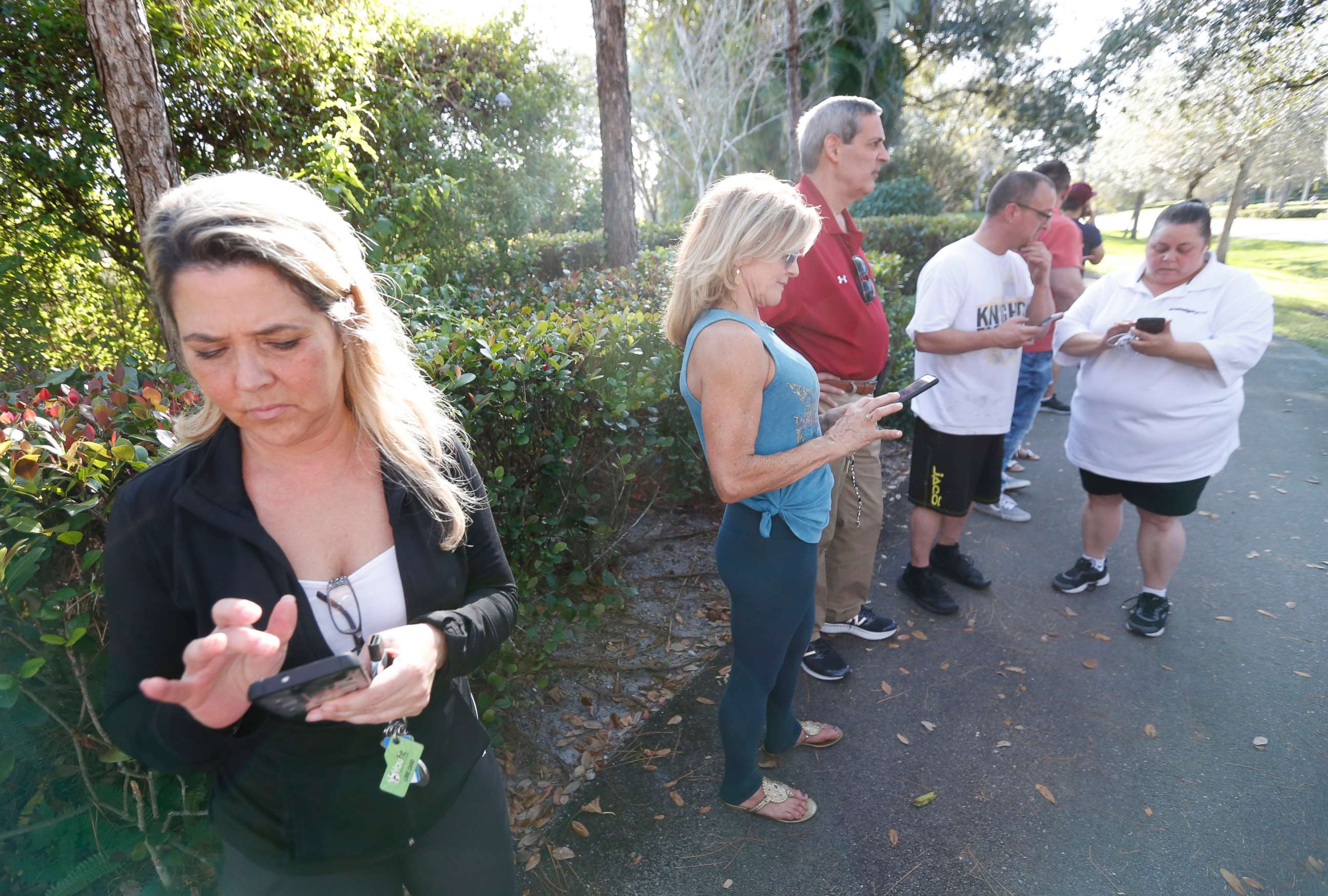PHOTO: Anxious family members wait for information on students, Feb. 14, 2018, in Parkland, Fla. after a shooting at Marjory Stoneman Douglas High School.