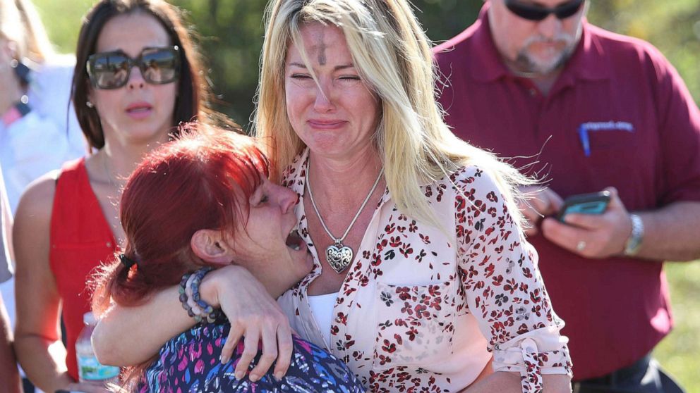 PHOTO: Women embrace in a waiting area for parents of students after a shooting at Marjory Stoneman Douglas High School in Parkland, Fla., Feb. 14, 2018.