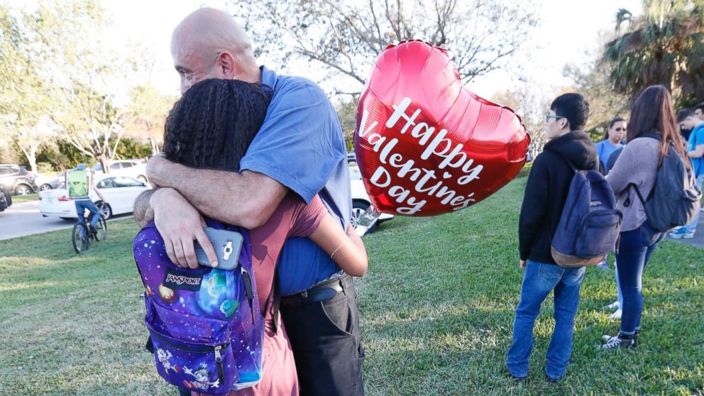 PHOTO: Family members embrace following a shooting at Marjory Stoneman Douglas High School, Feb. 14, 2018, in Parkland, Fla.