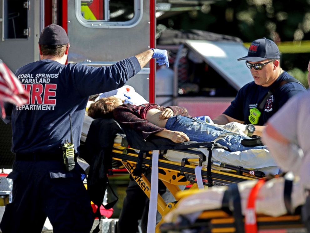 PHOTO: Medical personnel tend to a victim following a shooting at Marjory Stoneman Douglas High School in Parkland, Fla., on Feb. 14, 2018.