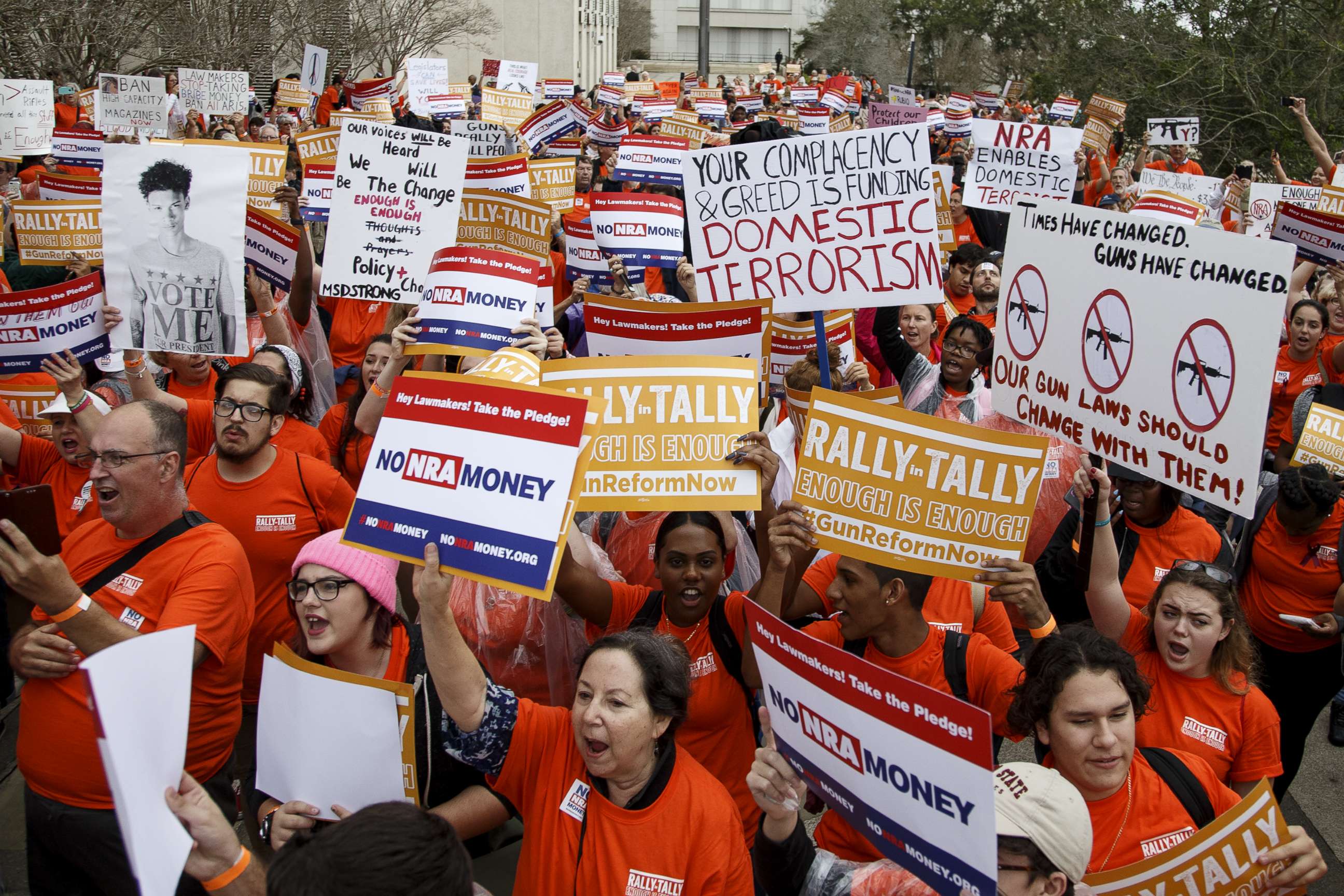 PHOTO: Activists hold up signs at the Florida State Capitol as they rally for gun reform legislation, Feb. 26, 2018, in Tallahassee, Fla.