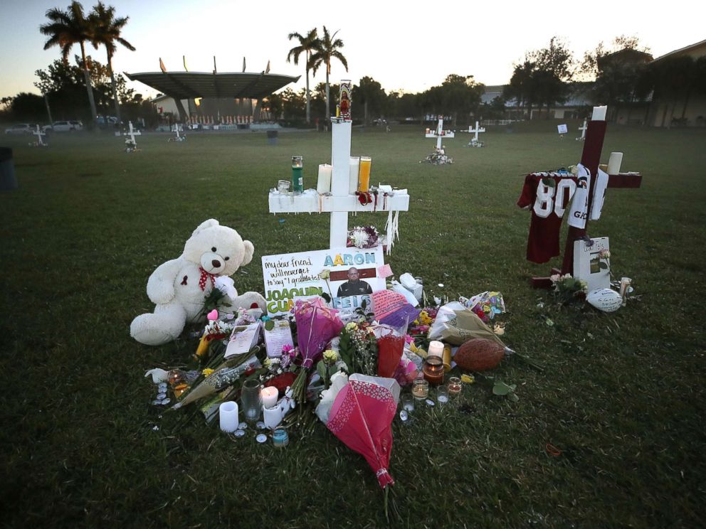 PHOTO: Flowers and mementos are placed on a memorial site, Feb. 17, 2018, for those killed mass shooting at Marjory Stoneman Douglas High School, in Parkland, Fla.