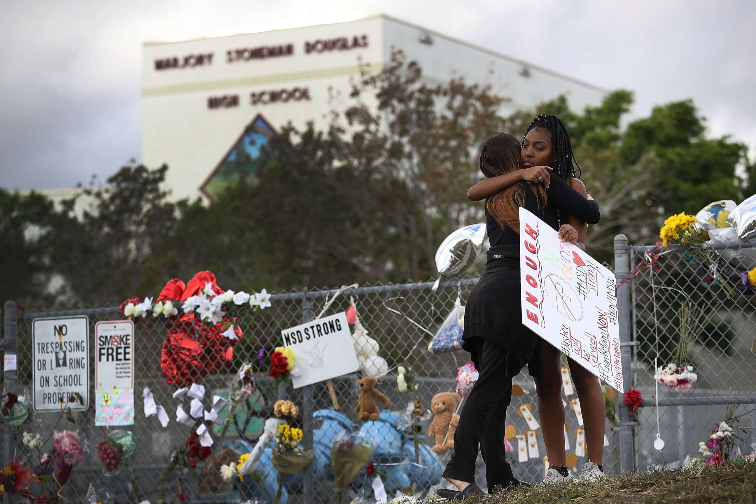 PHOTO: Tyra Heman, right, a senior at Marjory Stoneman Douglas High School, is hugged by Rachael Buto in front of the school where 17 people were killed in a mass shooting, Feb. 19, 2018 in Parkland, Fla.