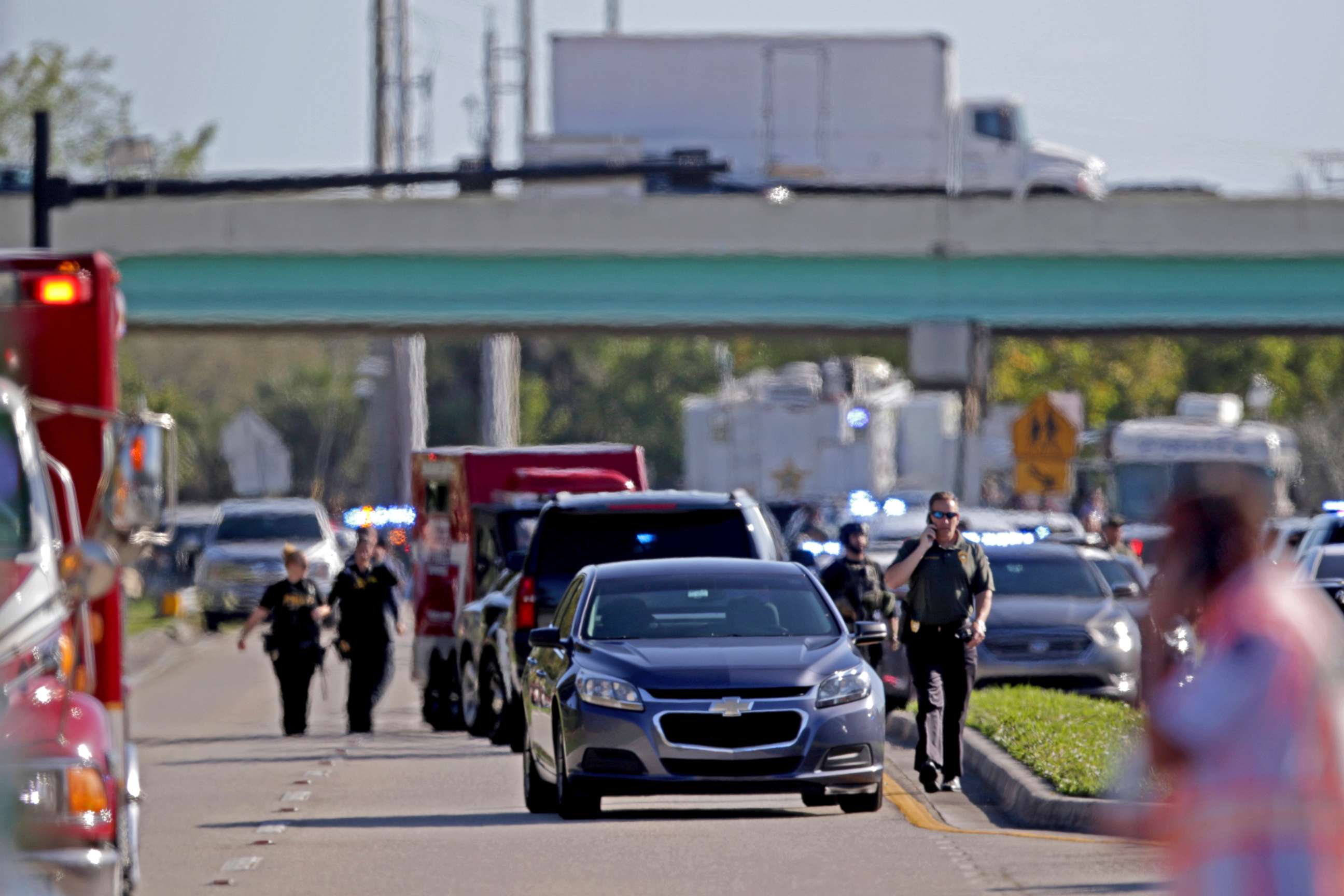 PHOTO: Police and fire rescue vehicles converge following a shooting at Marjory Stoneman Douglas High School in Parkland, Fla., Feb. 14, 2018.