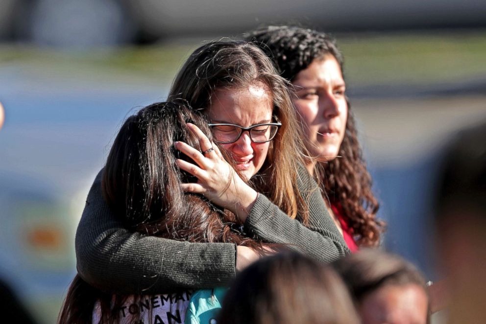 PHOTO: Students released from a lockdown embrace following a shooting at Marjory Stoneman Douglas High School in Parkland, Fla., Feb. 14, 2018.