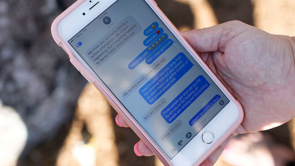 PHOTO: Alana Koer, of Parkland, Fla., shows the text messages she exchanged with her son during the shooting at Marjory Stoneman Douglas High School, during a vigil on Feb. 15, 2018.