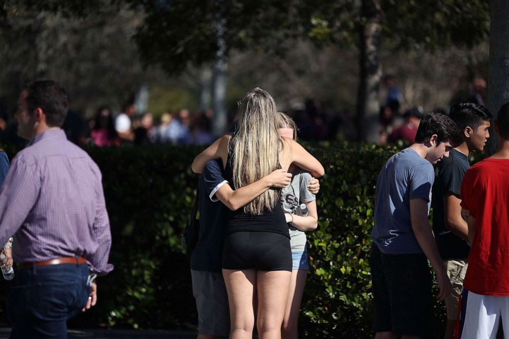 PHOTO: Students of Marjory Stoneman Douglas High School gather at Pine Trail Park, on Feb. 15, 2018 in Parkland, Fla., the day after a mass shooting in the school.