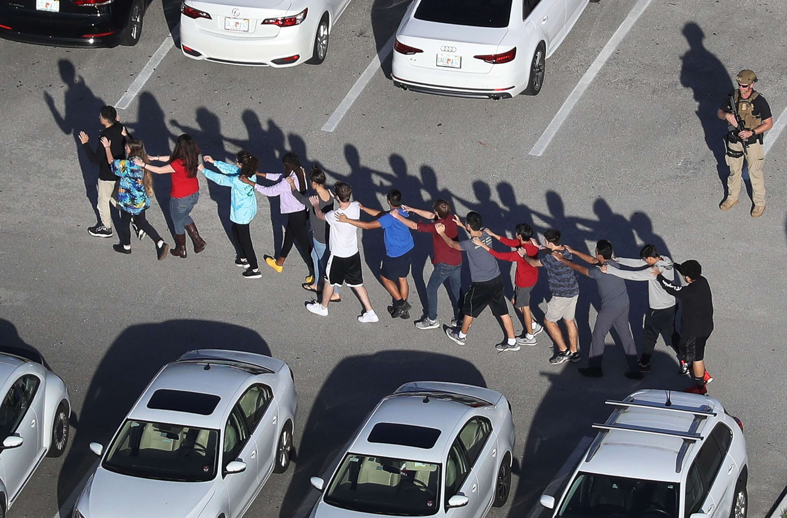 PHOTO: In this Feb.14, 2018 file photo people are brought out of the Marjory Stoneman Douglas High School after a shooting at the school in Parkland, Fla.