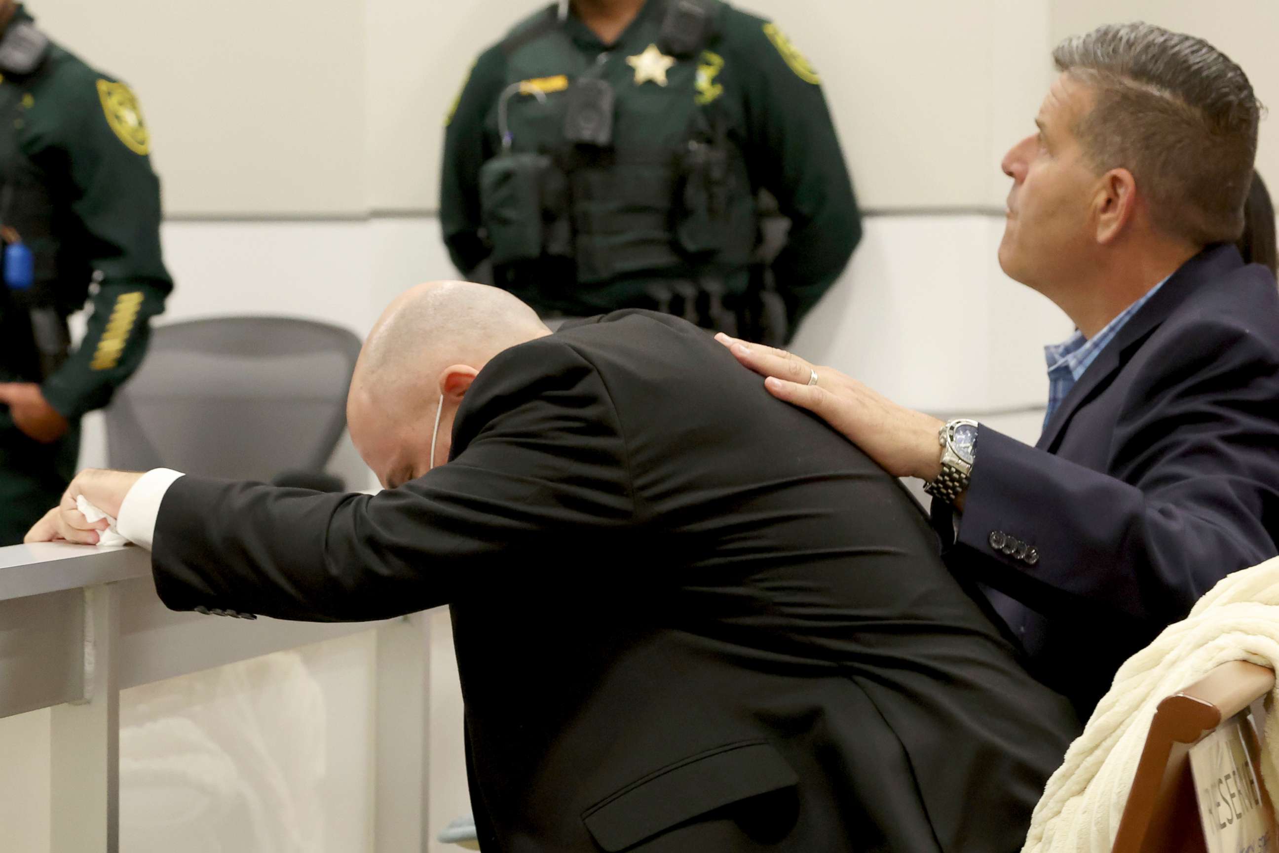 PHOTO: Ilan Alhadeff is comforted as he returns to his seat after giving his victim impact statement at the Broward County Courthouse in Fort Lauderdale, Fla., Aug. 2, 2022