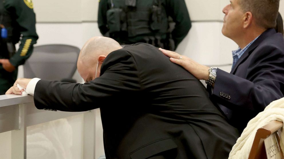 PHOTO: Ilan Alhadeff is comforted as he returns to his seat after giving his victim impact statement at the Broward County Courthouse in Fort Lauderdale, Fla., Aug. 2, 2022