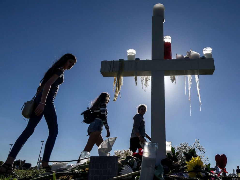 PHOTO: People visit the temporary memorial at the amphitheater at Pine Trails Park, Parkland, Florida, Feb. 16, 2018. The memorial honors victims of a mass shooting that took place at Marjory Stoneman Douglas High School that left 17 dead.