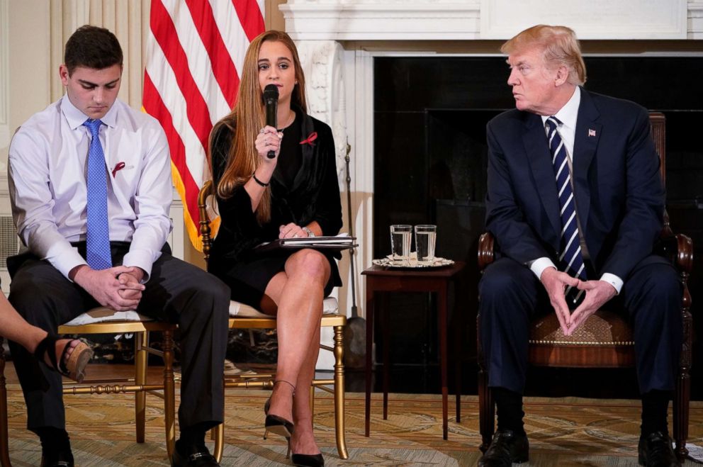 PHOTO: President Donald Trump listens to Julia Cordover, center, the Parkland student body president, as she speaks during a listening session on gun violence in the State Dining Room of the White House.