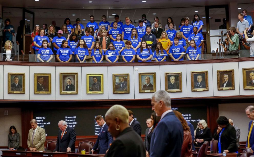 PHOTO: Students and their chaperones from Marjory Stoneman Douglas High School, wearing blue t-shirts, stand in the gallery above the Florida Senate as it held a moment of silence in honor of the victims of the mass shooting, February 21, 2018.