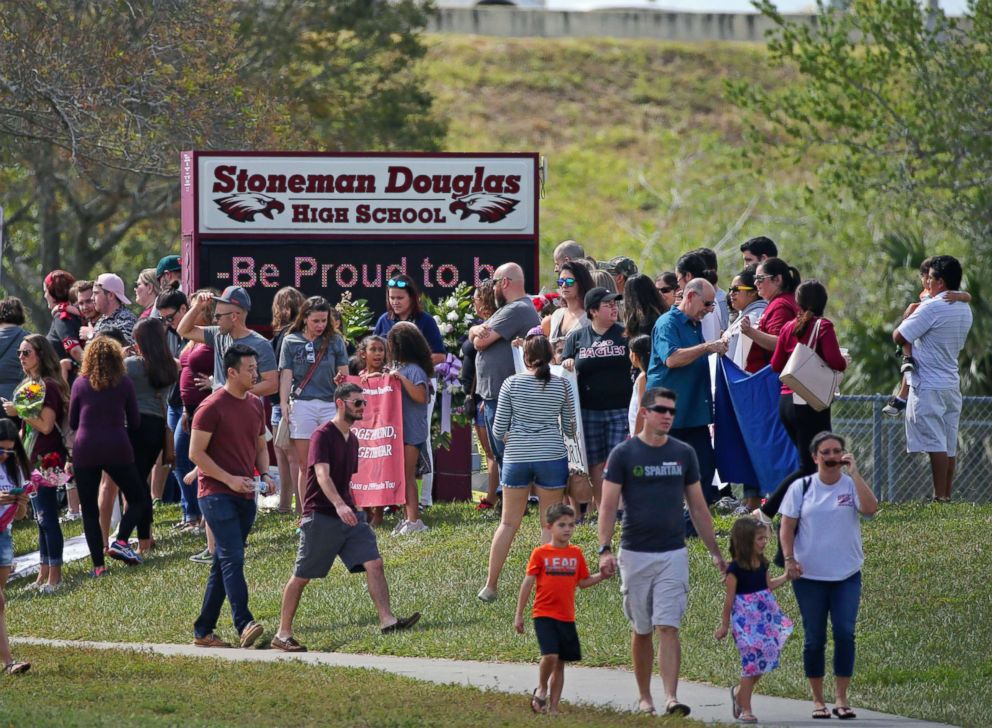 PHOTO: Parents and students arrive at Marjory Stoneman Douglas High School for an open house, Feb. 25, 2018. This was the first time students returned to the school since the shooting that killed 17 students. 