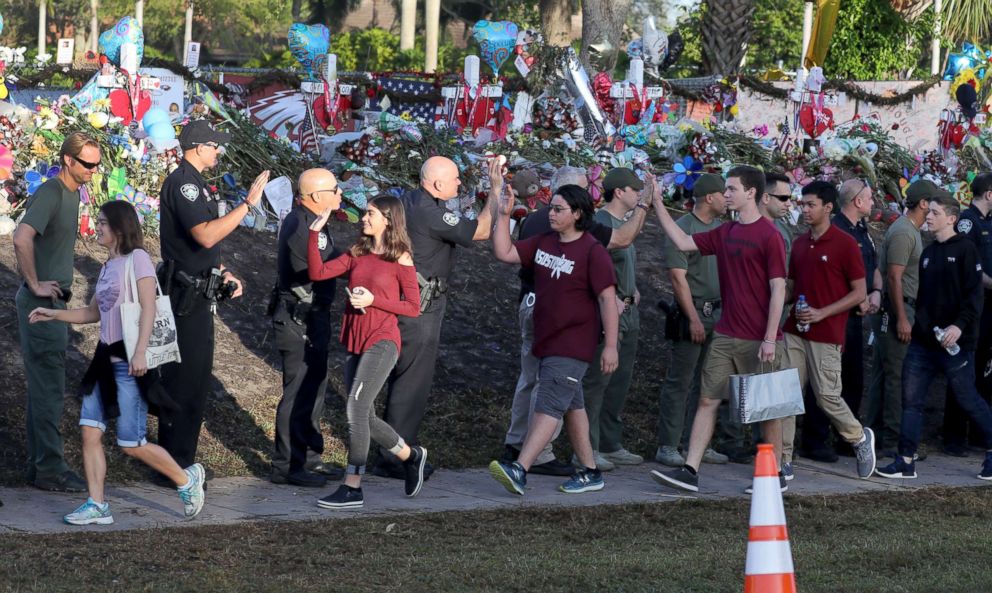 PHOTO: Students are greeted by law enforcement officers as they head back to school at Marjory Stoneman Douglas High School, Feb. 28, 2018 in Parkland, Fla.
