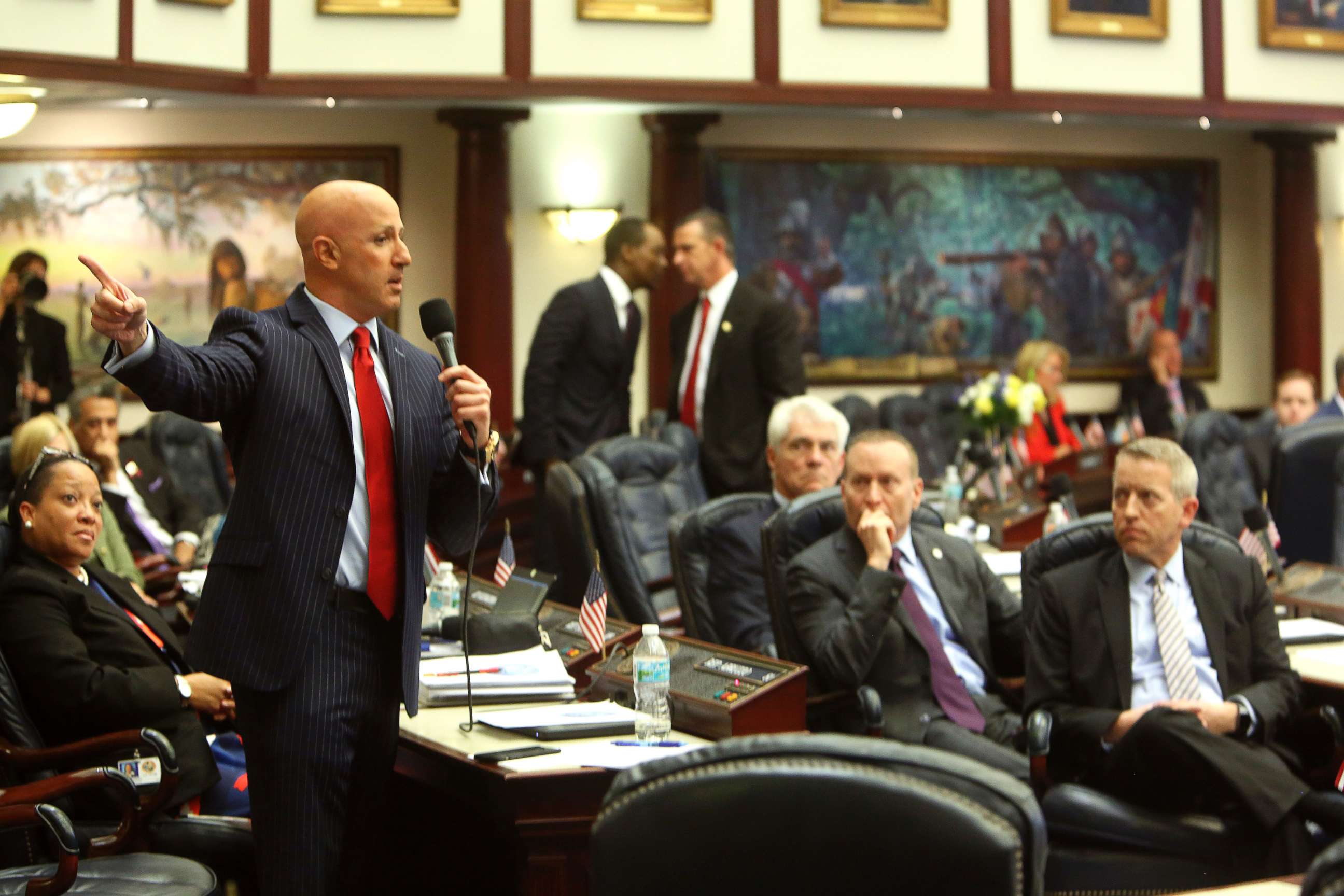 PHOTO: Florida State Rep. Joseph Abruzzo, left, debates the gun/school safety bill on the floor of the House, March 7, 2018 in Tallahassee. 