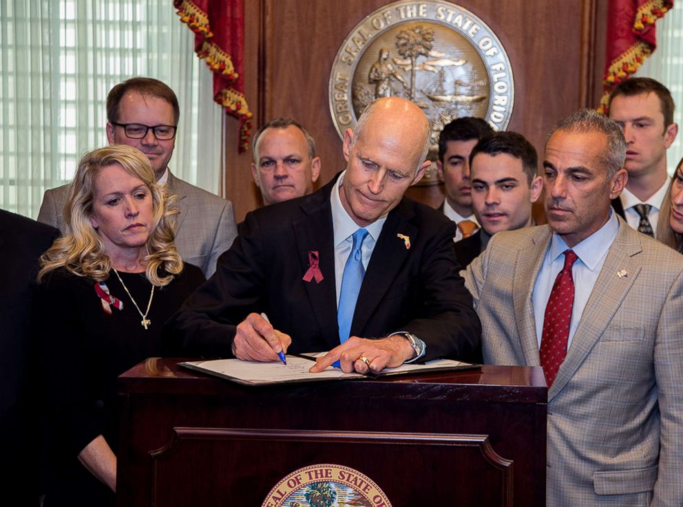 PHOTO: Florida Gov. Rick Scott signs the Marjory Stoneman Douglas Public Safety Act in the governor's office at the Florida State Capitol in Tallahassee, Fla., March 9, 2017. 