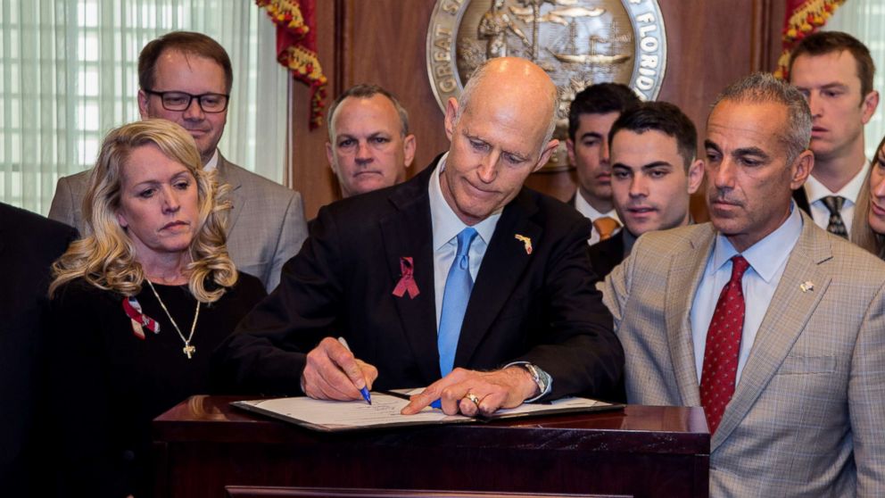 PHOTO: Florida Gov. Rick Scott signs the Marjory Stoneman Douglas Public Safety Act in the governor's office at the Florida State Capitol in Tallahassee, Fla., March 9, 2017. 