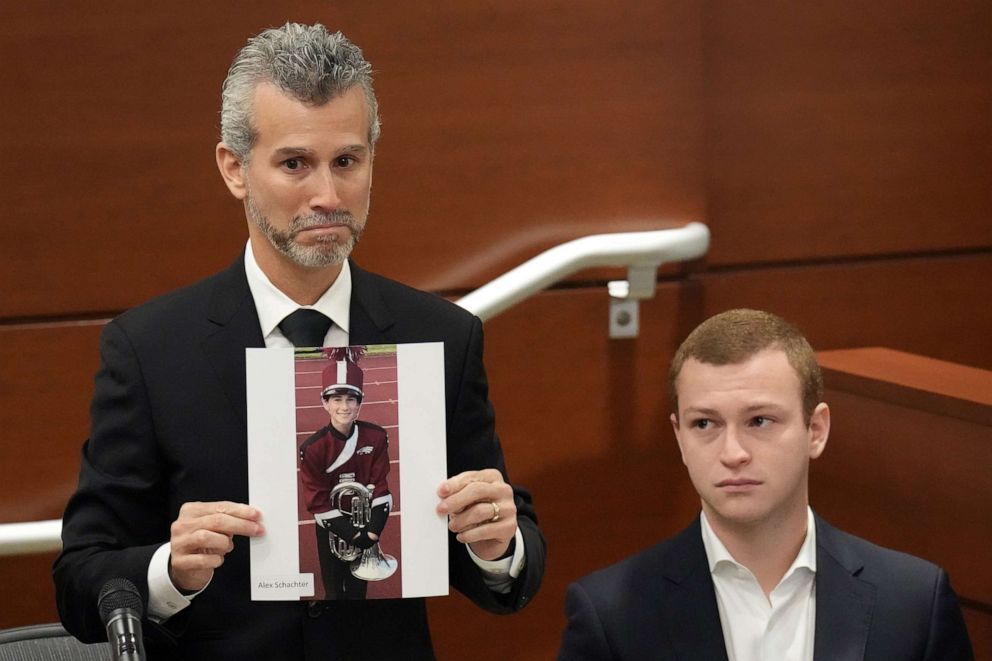 PHOTO: Max Schachter, with his son, Ryan holds a photograph of his other son, Alex, just before giving his victim impact statement during the penalty phase in the trial of MSD shooter Nikolas Cruz on Aug. 3, 2022 in Fort Lauderdale, Fla.