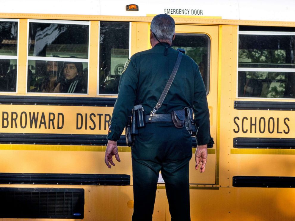 PHOTO: A police officer on duty the Marjory Stoneman Douglas High School entrance as parents and students arrive at the High School in Parkland, Fla. Feb.28, 2018, for the schools reopening, two weeks after the mass shootings at the school.