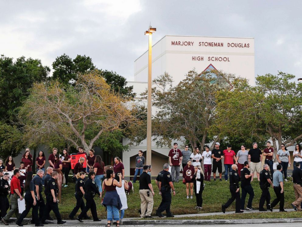 PHOTO: Police walk outside Marjory Stoneman Douglas High School in Parkland, Fla., Feb. 28, 2018.