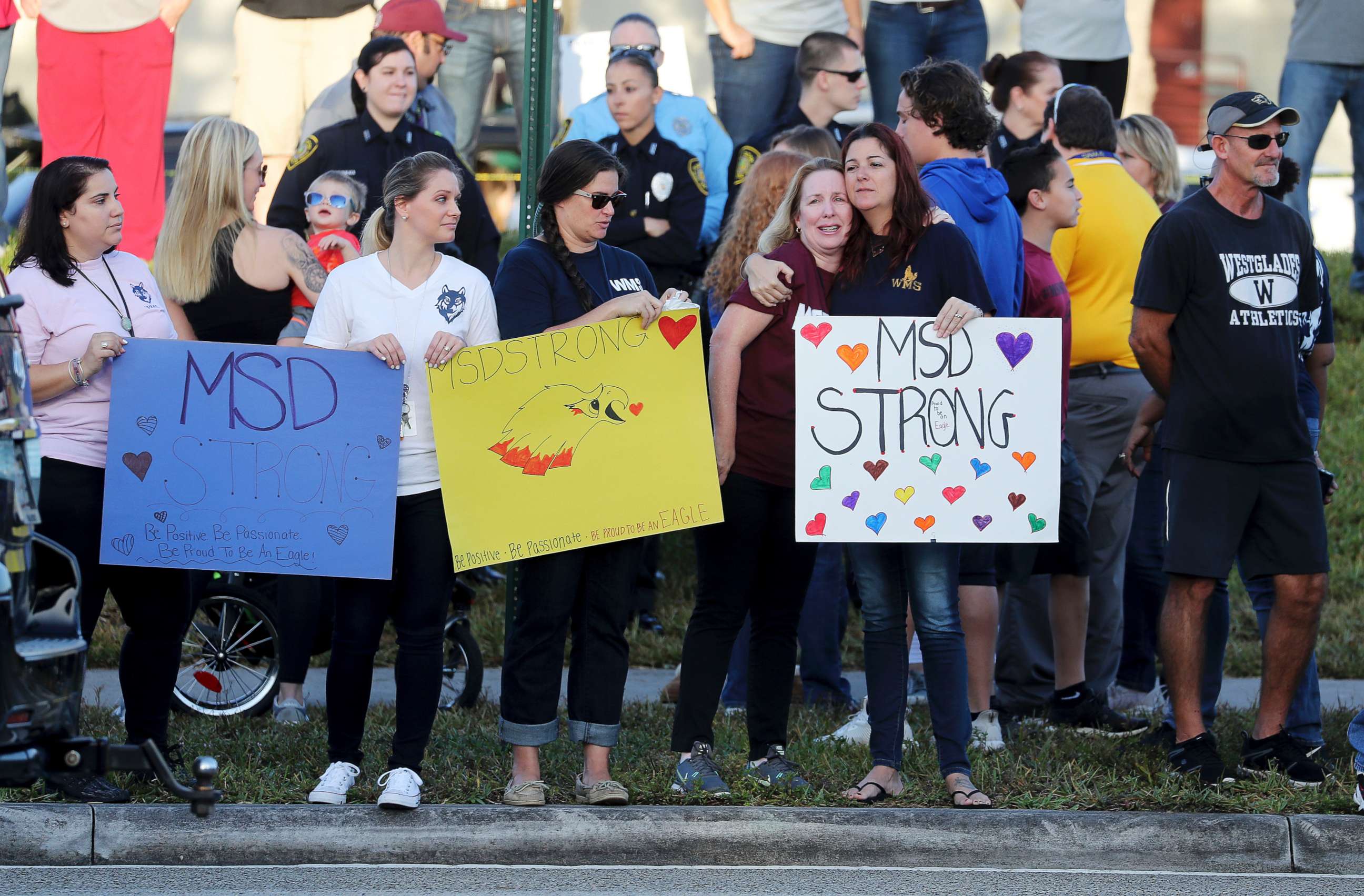 PHOTO: Supporters hold signs as students head back to classes at Marjory Stoneman Douglas High School in Parkland, Fla., Feb. 28, 2018.