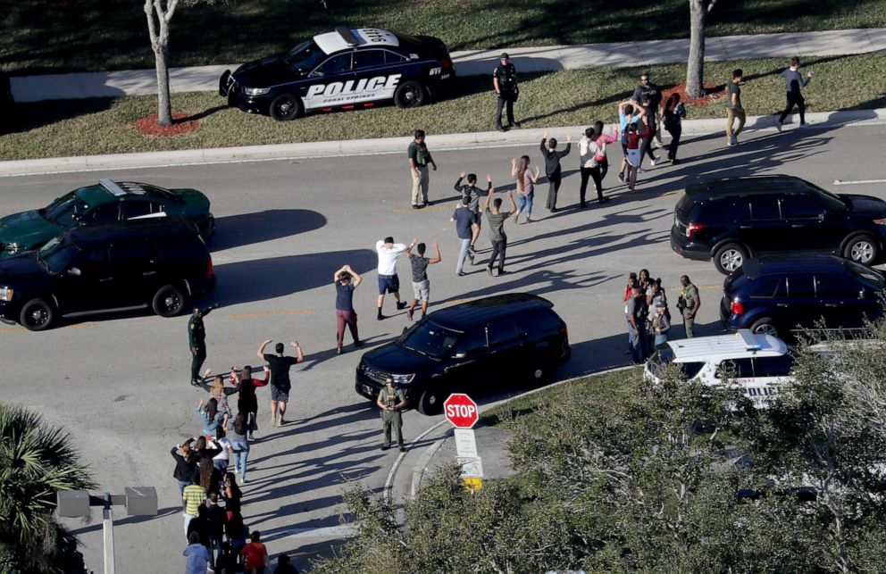 PHOTO: Students are evacuated by police out of Stoneman Douglas High School in Parkland, Fla., after a shooting, Feb. 14, 2018.