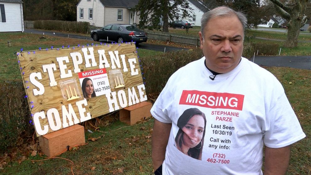 PHOTO: Edward Parze stands next to a large sign Nov. 18, 2019, outside his Freehold home that asks his missing daughter Stephanie to come home.