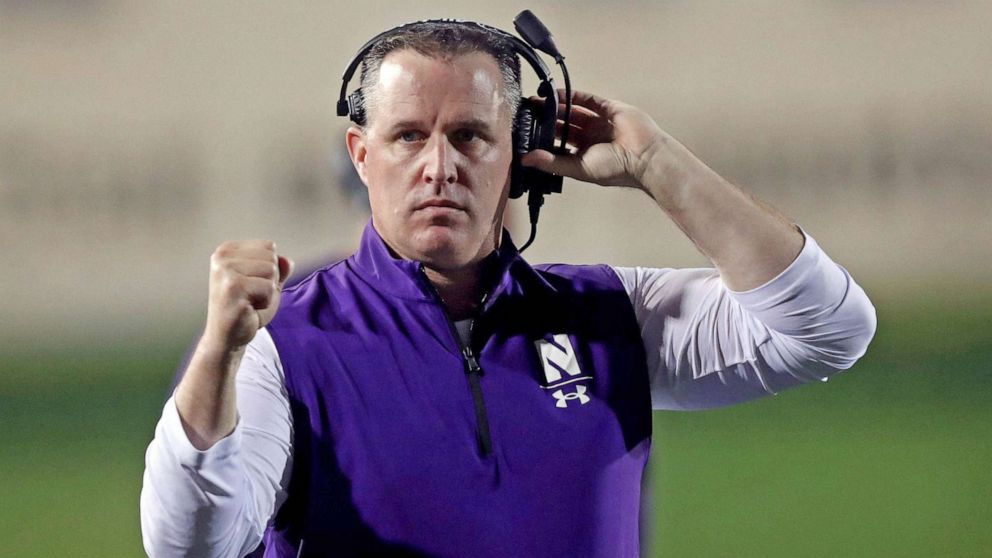 PHOTO: FILE - Northwestern coach Pat Fitzgerald pumps his fist after a touchdown against Michigan State, Sept. 3, 2021, at Ryan Field in Evanston, Illinois.