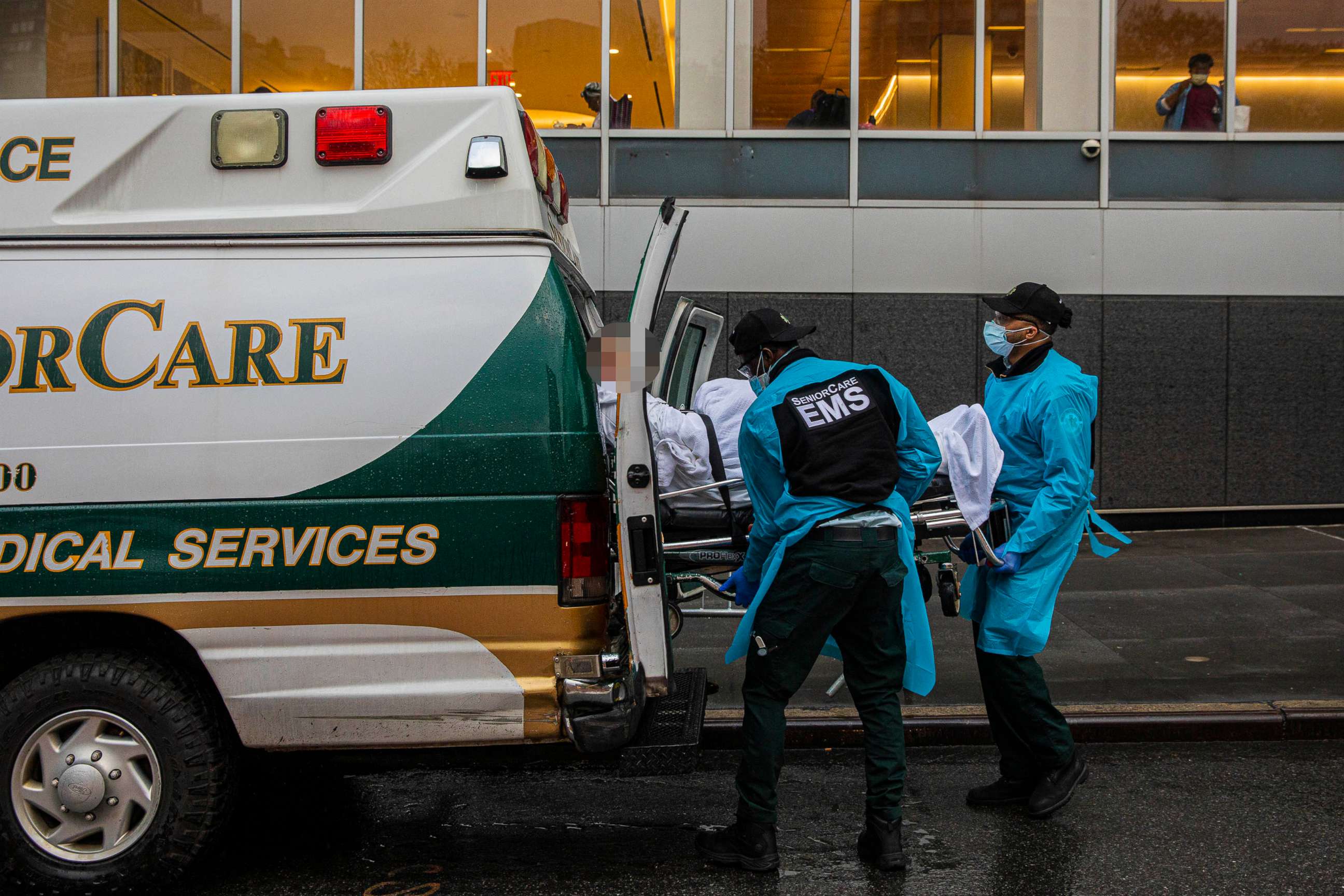 PHOTO: Medical personnel move a patient outside NYU Langone Medical Center in New York, May 6, 2020.