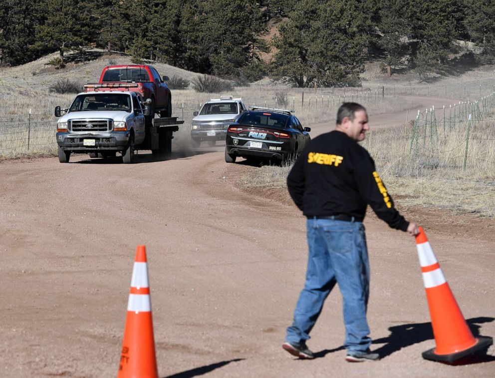 PHOTO: The Woodland Park police department tows a truck down a private road from Patrick Frazees home in Teller County, Dec. 14, 2018.