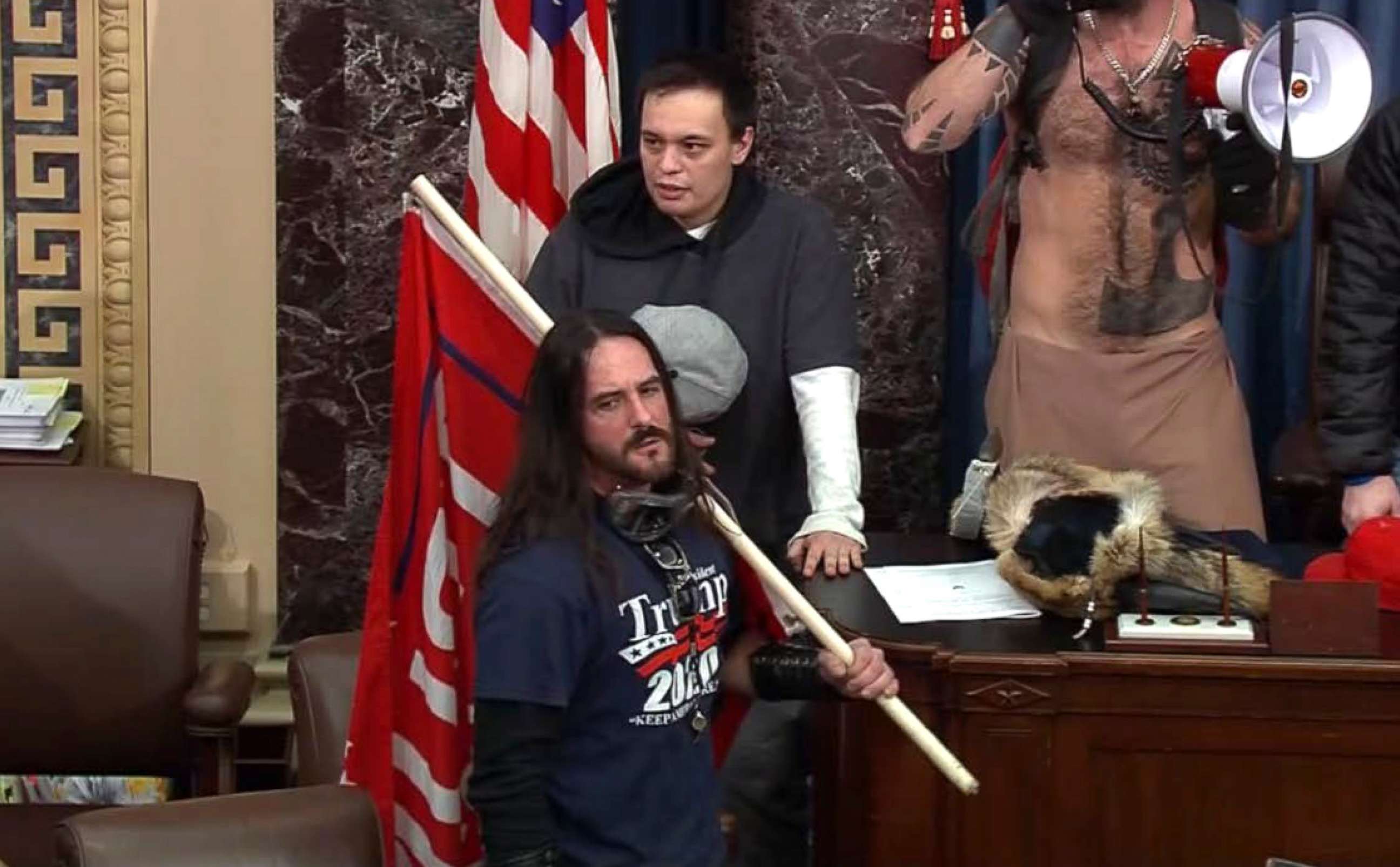 PHOTO: Paul Allard Hodgkins, 38, of Tampa, Fla., front, stands in the well on the floor of the U.S. Senate on Jan. 6, 2021, at the Capitol in Washington, in an image made from U.S. Capitol Police video.