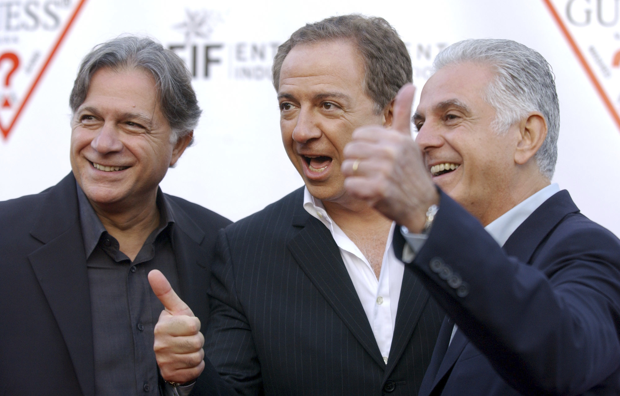 In this May 9, 2002 file photo, Guess Inc. founders and brothers, from left, Armand, Paul and Maurice Marciano arrive at the company's 20th anniversary party in Los Angeles.