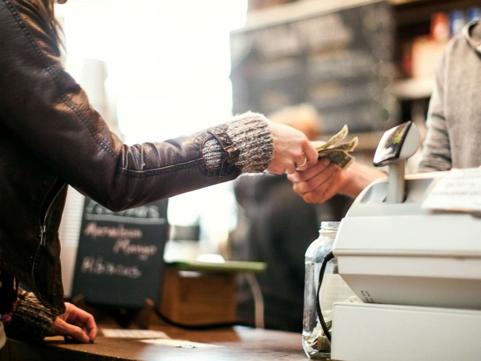 PHOTO: A woman pays for an item in this stock photo.