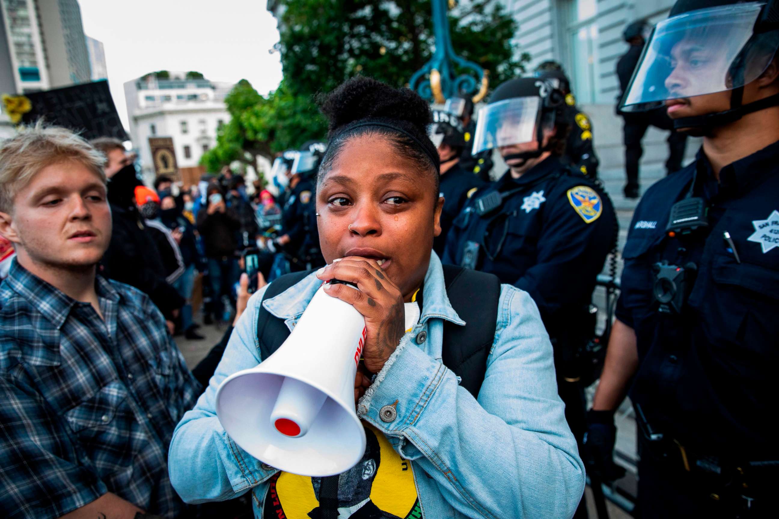 PHOTO: Marie Moroe of San Francisco, Calif., pleads with demonstrators to leave the scene before curfew, during a protest over the police killing of George Floyd, outside City Hall in San Francisco, May 31, 2020.