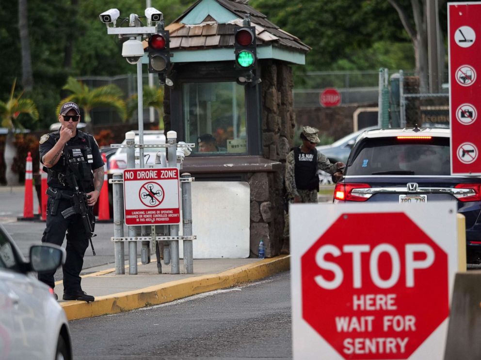 PHOTO: A guard stands by at the Nimitz Gate of Pearl Harbor in Hawaii shortly after a sailor fatally shot two civilians at the Pearl Harbor Naval Shipyard in Honolulu on Dec. 4, 2019.